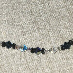 Swarovski crystal necklace, navy blue and iridescent beads. 15"